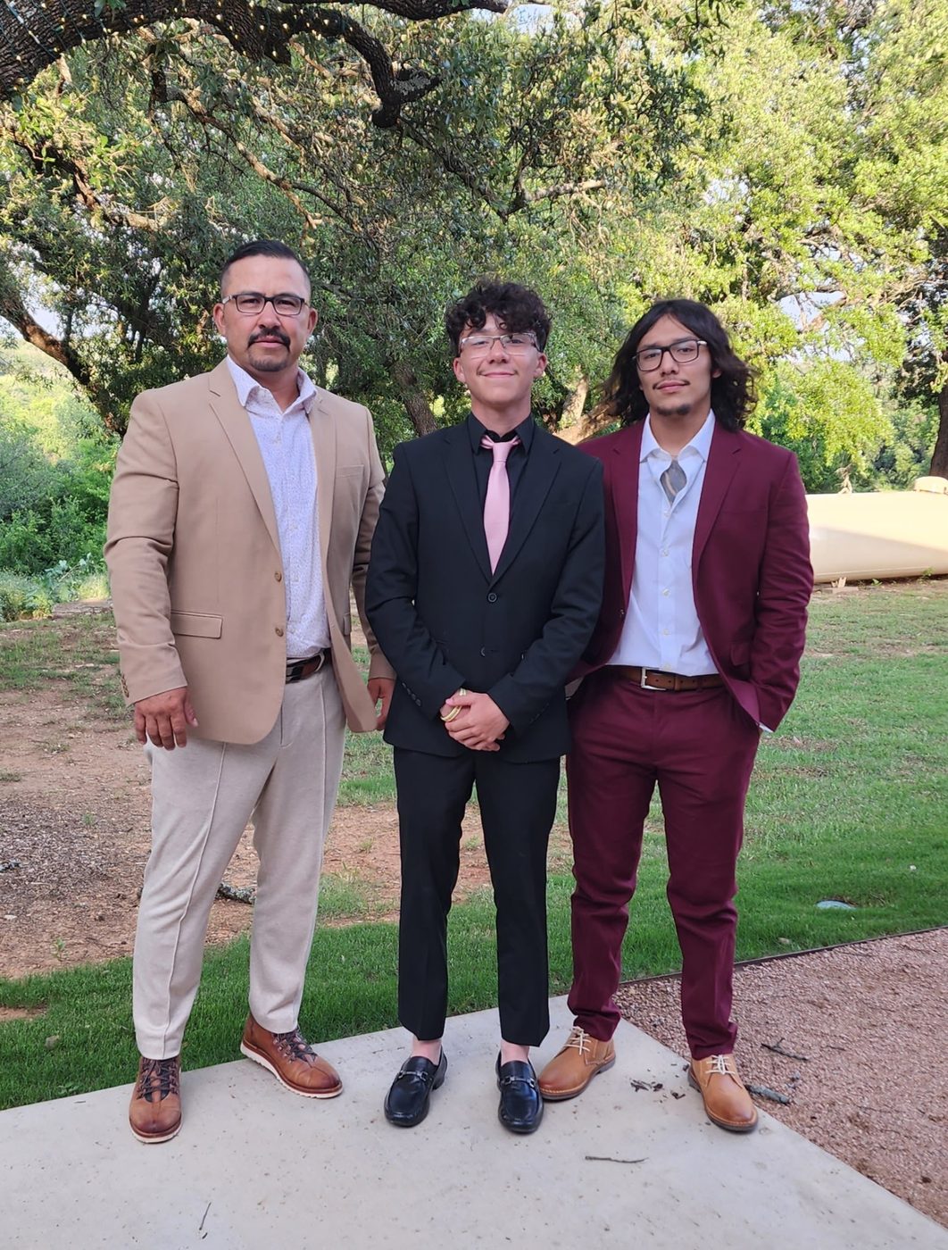 Noe Gomez with his sons Noaa and Ulises — the family behind Bold Gold Lawn Services in Midland, Texas